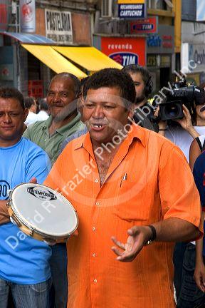 Street musician playing the tambourine in Sao Paulo, Brazil.