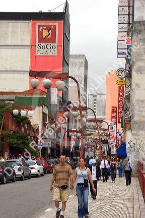 People walking in the Liberdade Asian section of Sao Paulo, Brazil.