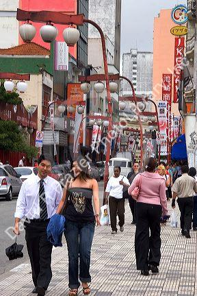 People walking in the Liberdade Asian section of Sao Paulo, Brazil.