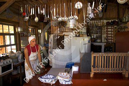 Brazilian woman working in a rustic country restaurant near Sao Paulo, Brazil.