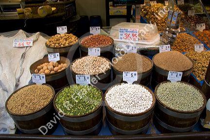 A variety of dried beans, lentils, and nuts being sold at the Mercado Municipal in Sao Paulo, Brazil.