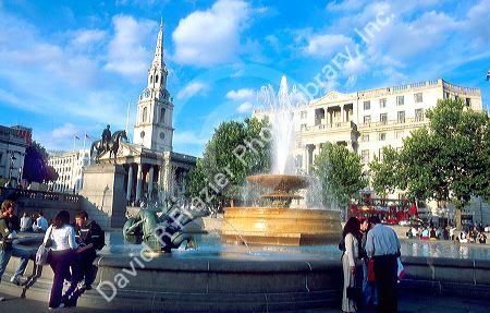 Trafalgar Square in London, England is crowded with local residents and tourists daily.