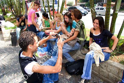 Students taking photographs and socializing in Sao Paulo, Brazil.