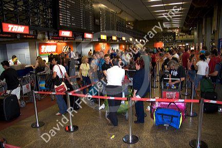 Tam ticket counter at crowded airport in Sao Paulo, Brazil.