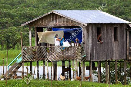 Daily life in a house on stilts in the Amazon, Brazil.