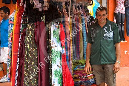 A vendor selling hammocks at an outdoor market in Manaus, Brazil.