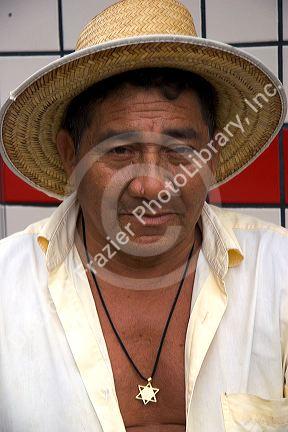 Elderly Brazilian man wearing a straw hat in Manaus, Brazil.