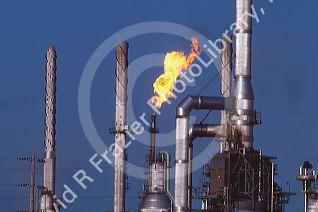 An oil refinery with gas flame.