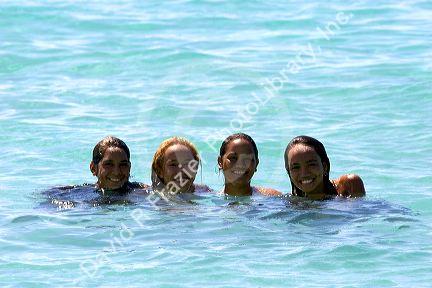 Tahitian girls in the lagoon off the island of Moorea.