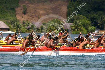 Tahitians take part in an outrigger canoe pirogue race off the island of Moorea.
