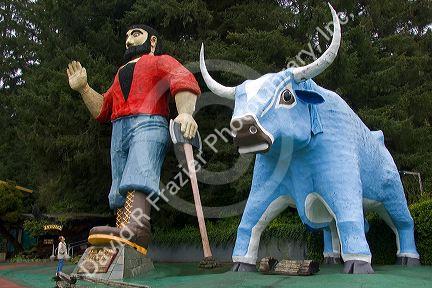 Giant statues of Paul Bunyan and Babe the Blue Ox guard the entrance of the Trees of Mystery at Klamath, California.