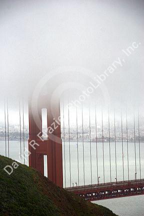 A view of the Golden Gate Bridge and fog in San Francisco, California.