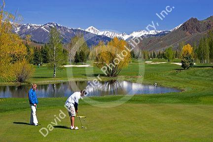 Golfing in Sun Valley, Idaho with the Boulder Mountains in the background.