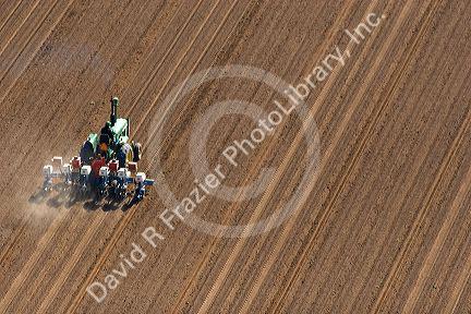 Aerial view of a farmer on a tractor planting seed in Canyon County, Idaho.