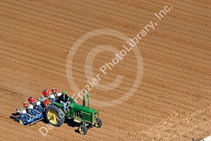 Aerial view of a farmer on a tractor planting seed in Canyon County, Idaho.