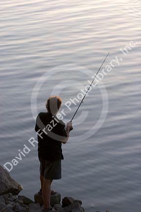 Man fishing at C.J. Strike Reservior on the Snake River in Idaho.