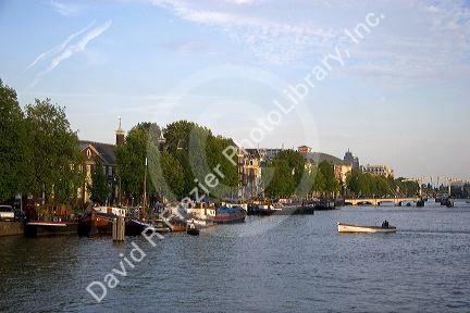 Boating on the Amstel River in Amsterdam, Netherlands.