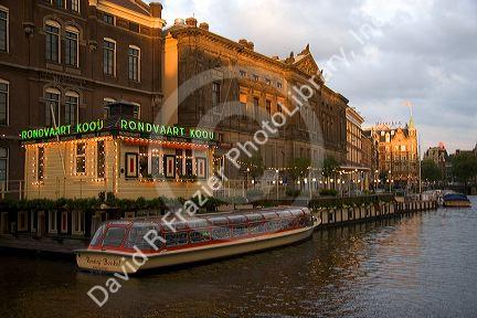 Canal boat tours on the Amstel River in Amsterdam, Netherlands.