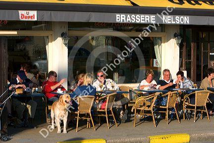 People dine at an outdoor cafe at Nieuwpoort in the province of West Flanders, Belgium.