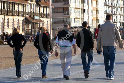 People walk on the promenade at Nieuwpoort in the province of West Flanders, Belgium.