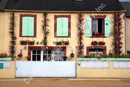 Home with a nice display of geraniums in the department of Manche, France.