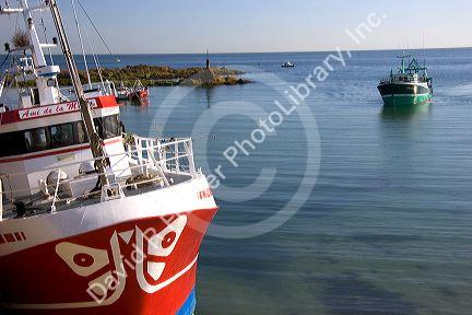 Fishing boats in the harbor at the village of Barfleur in the region of Basse-Normandie, France.