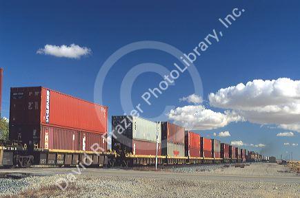 Piggyback containers on a train.