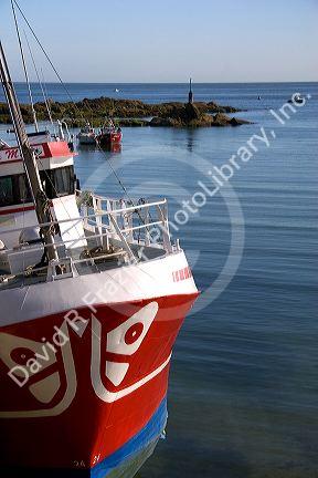 Fishing boat in the harbor at the village of Barfleur in the region of Basse-Normandie, France.