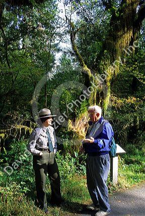 Female park ranger talking to a visitor at Olympic National Park, Washington.