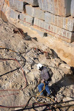 Worker drilling in a granite quarry in Elberton, Georgia.