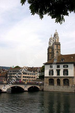 Munster Bridge crossing the Limmat River in Zurich, Switzerland with towers of Grossmunster church in background.switzerland, swiss, europe, european, travel, tourism, swiss alps, alps, alpine, zurich, limmat river, grossmunster, church, munster bridge