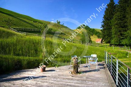 Rolling hills in the Alps near Zurich, Switzerland.alps, hills, grass, hay, farm, swiss, switzerland, agriculture, barn, europe, european, rolling hills