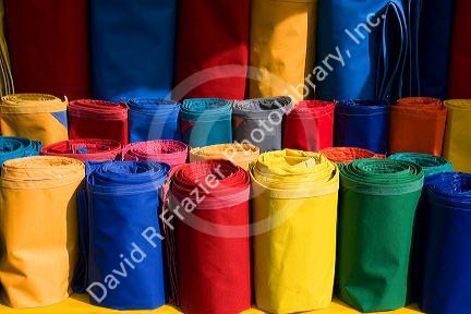 Rolls of colored canvas being sold at the Merced Market in Mexico City, Mexico.