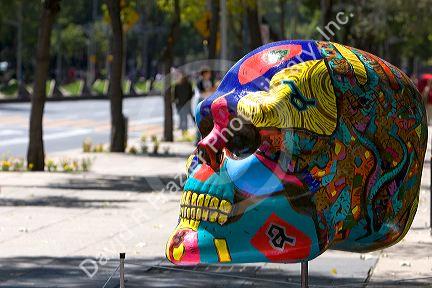 A painted skull is part of a public art display in celebration of Day of the Dead in Mexico City, Mexico.