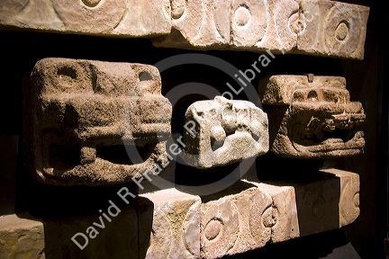 Carved serpent heads are artifacts from Teotihuacan on display in the National Museum of Anthropology in Mexico City, Mexico.