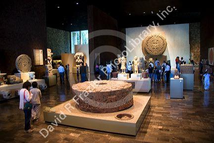 The Aztec Stone of the Sun and other artifacts on display at the National Museum of Anthropology in Mexico City, Mexico.