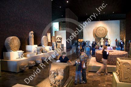 The Aztec Stone of the Sun and other artifacts on display at the National Museum of Anthropology in Mexico City, Mexico.
