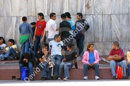 Young Mexicans hanging out at Insurgentes Plaza in Mexico City, Mexico.
