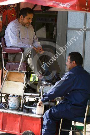 A shoeshiner at Insurgentes Plaza in Mexico City, Mexico.