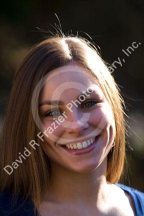 Portrait of a young woman smiling. MR