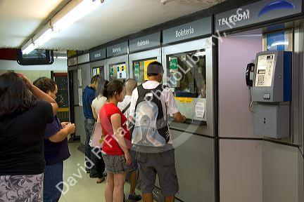 People buy tickets for the Buenos Aires Metro in Argentina.