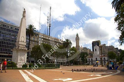 The Piramide de Mayo national monument and the Cabildo located in the Plaza de Mayo in Buenos Aires, Argentina. 