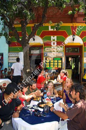 People dine outdoors in the La Boca barrio of Buenos Aires, Argentina.