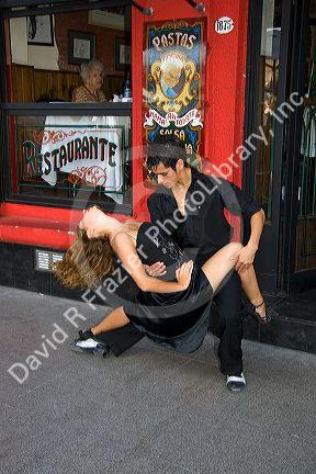 Tango dancers in front of a restaurant in Buenos Aires, Argentina.