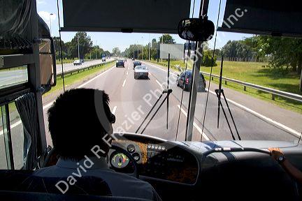 View over the shoulder of a bus driver in Buenos Aires, Argentina.