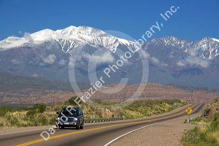 A view of the Andes Mountain Range with traffic on highway 7 near Mendoza, Argentina.
