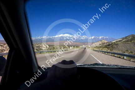 Driving on highway 7 with a view of the Andes Mountain Range near Mendoza, Argentina.