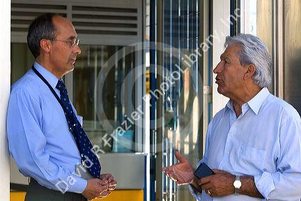 Businessmen talking in Valparaiso, Chile.