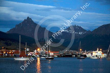 The harbor and city of Ushuaia at dusk on the island of Tierra del Fuego, Argentina.