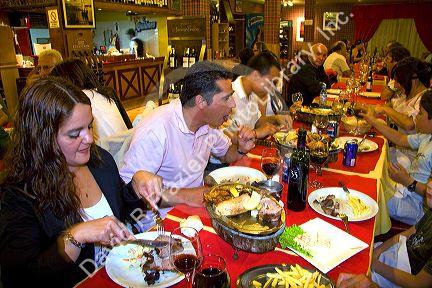 People dine in a restaurant at Ushuaia on the island of Tierra del Fuego, Argentina.